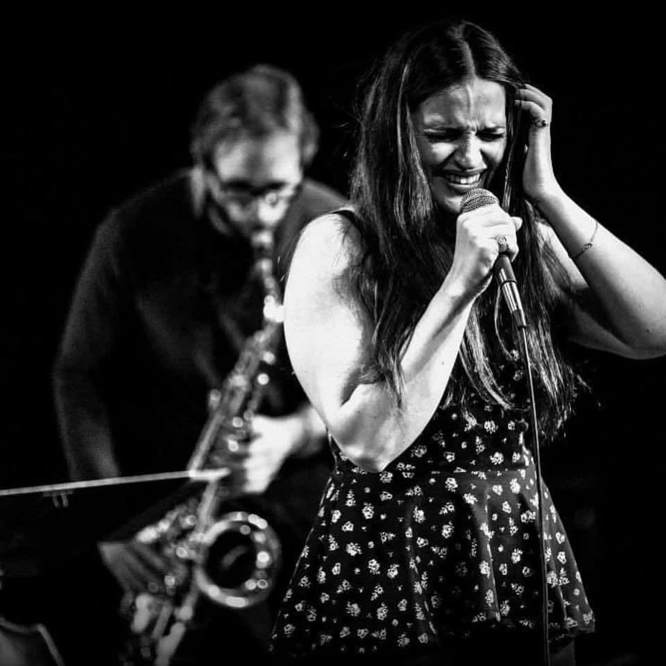 Liz Leila singing live on stage